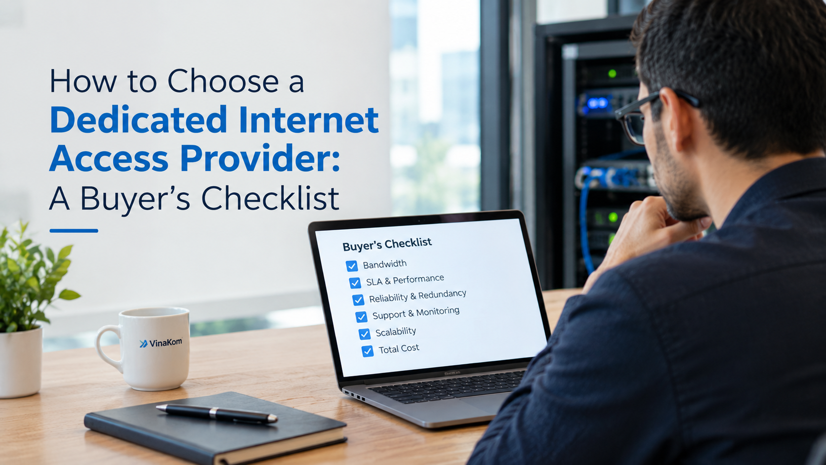 Business owner reviewing a dedicated internet access buyer's checklist on a laptop beside a network rack